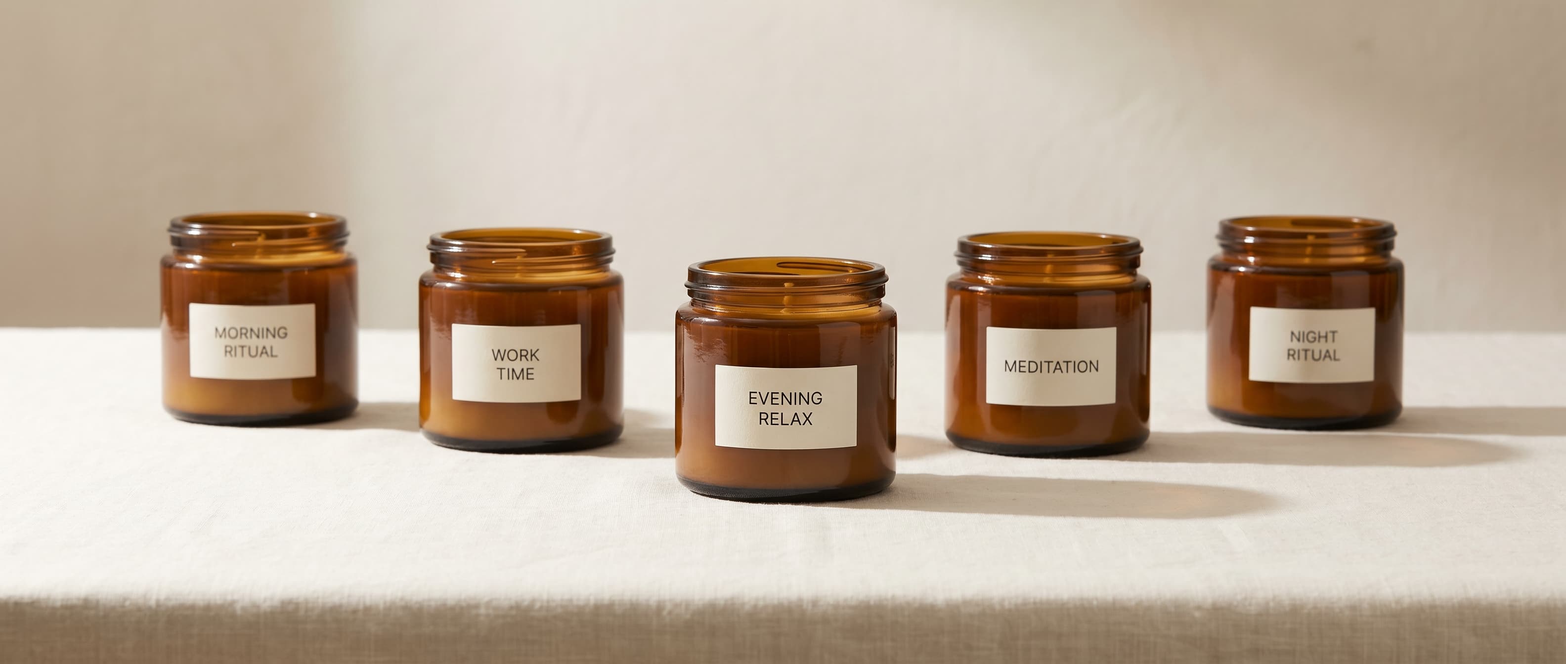 Five Cravista ritual candles in a line on a pale surface